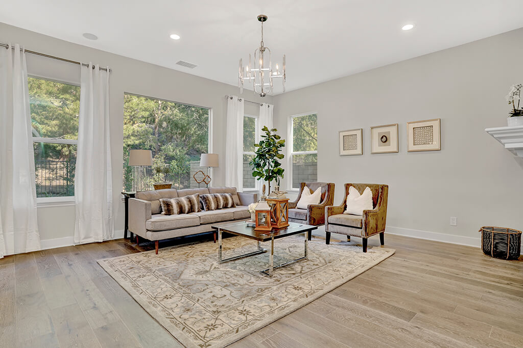 Wooden floor living room with plenty of windows in Orange County